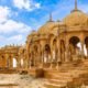 Panoramic view of Bada Bagh Jaisalmer showing ancient cenotaphs set against the desert landscape at sunset